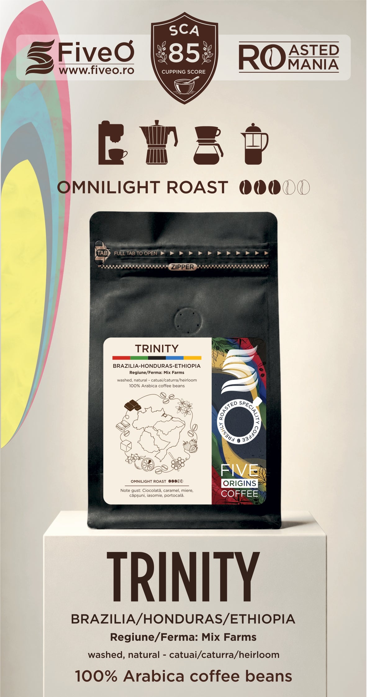 A coffee bag product display on a pedestal with branding for FiveO and Roasted in  Romania. The main subject is a black stand-up pouch labeled Trinity, with text indicating Omnilight Roast, Brazil/Honduras/Ethiopia origin, and 100% Arabica coffee beans.