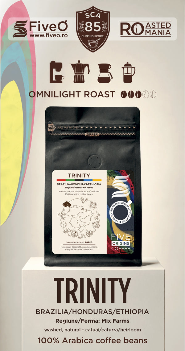 A coffee bag product display on a pedestal with branding for FiveO and Roasted in  Romania. The main subject is a black stand-up pouch labeled Trinity, with text indicating Omnilight Roast, Brazil/Honduras/Ethiopia origin, and 100% Arabica coffee beans.