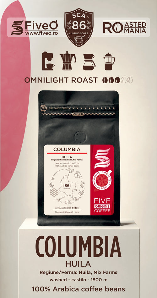 A coffee bag displayed on a pedestal with promotional text and branding. The product shown is a black coffee bag labeled Columbia Huiila, Five O, with a red and white side panel.