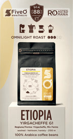 A bag of FiveO Omnilight Roast Ethiopia Yirgacheffe G2 coffee beans displayed on a white pedestal against a beige background with brand and roast graphics.